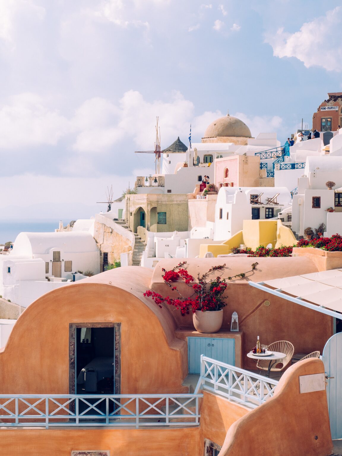 Vertical shot of beautiful buildings in Santorini island in the Aegean Sea, Cyclades, Greece